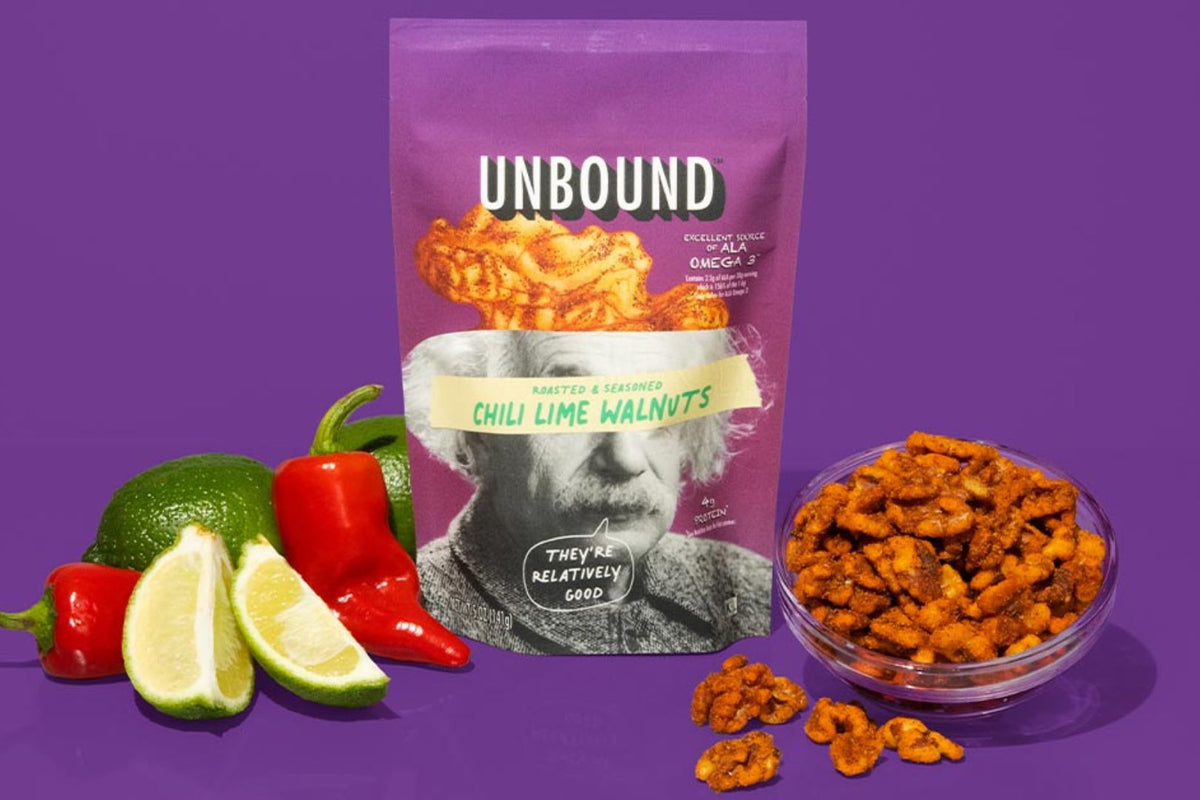 Unbound Chli lime walnut pouch with chili, limes and bowl of walnuts next to the pouch
